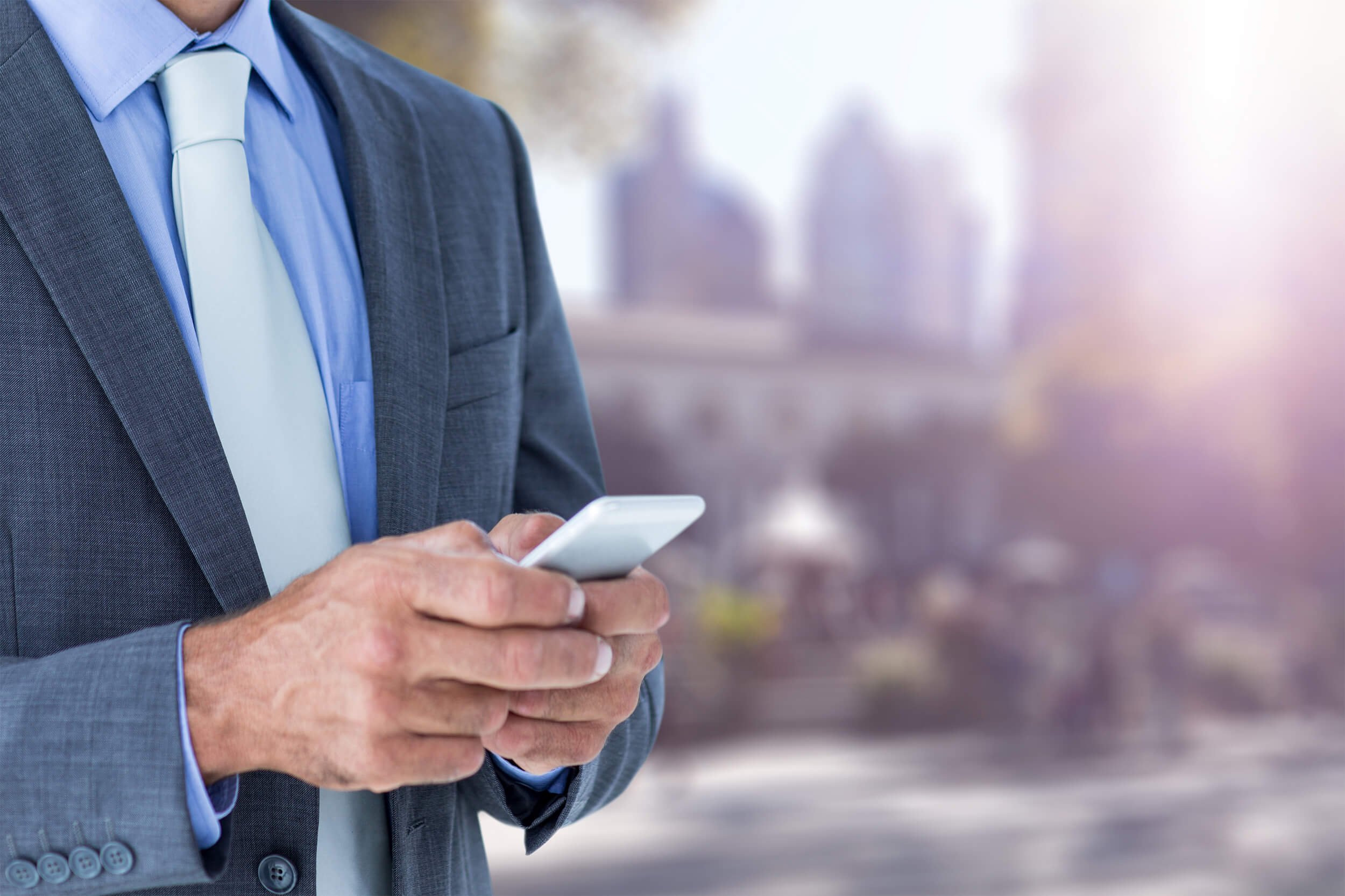 close up businessman using his smartphone 1