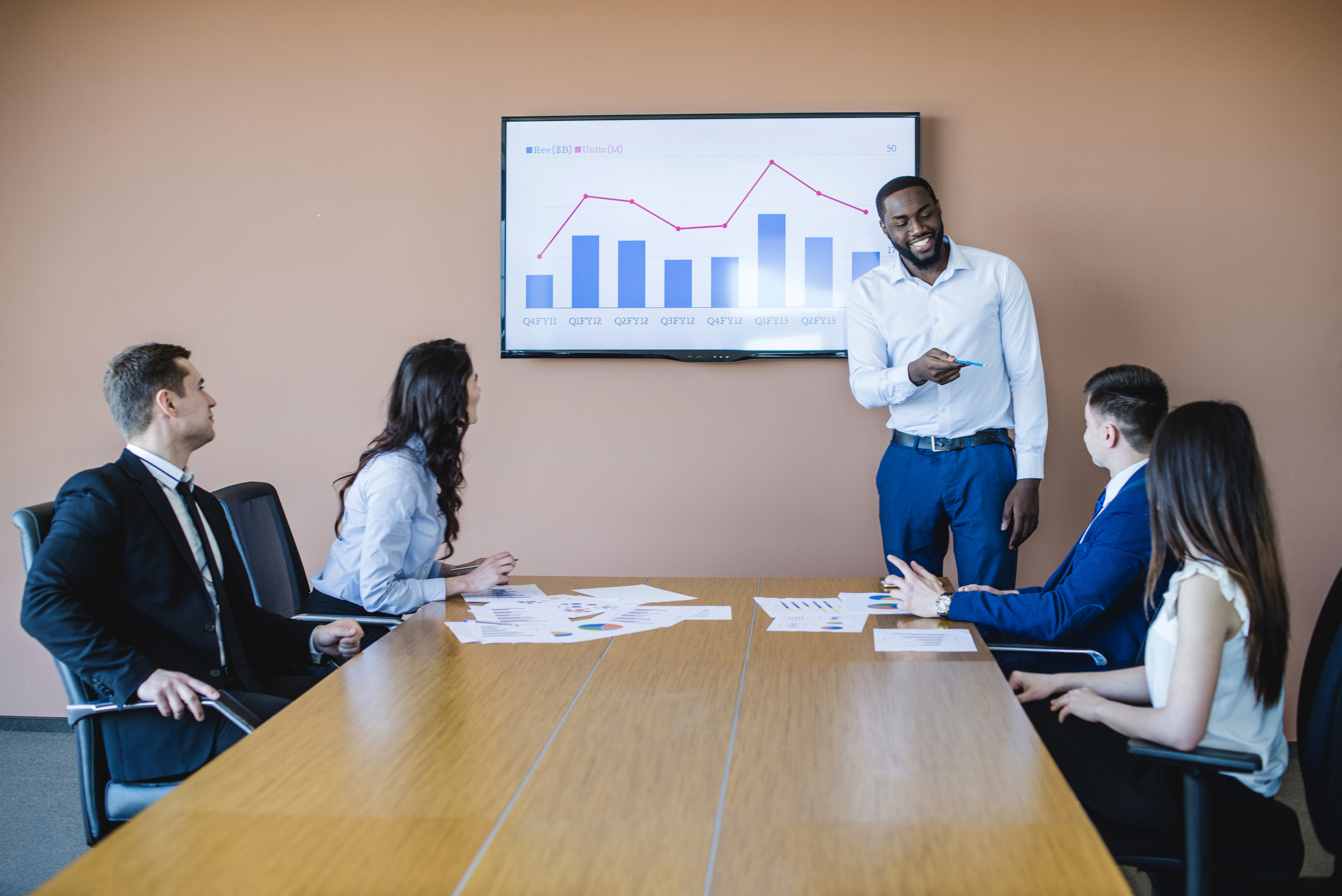 business meeting long table with chart